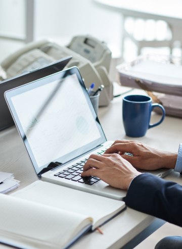 workers using laptops in the office